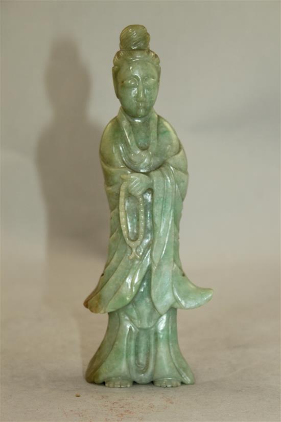 A Chinese jadeite standing figure of Guanyin, early 20th century, MEASUREMENT, wood stand